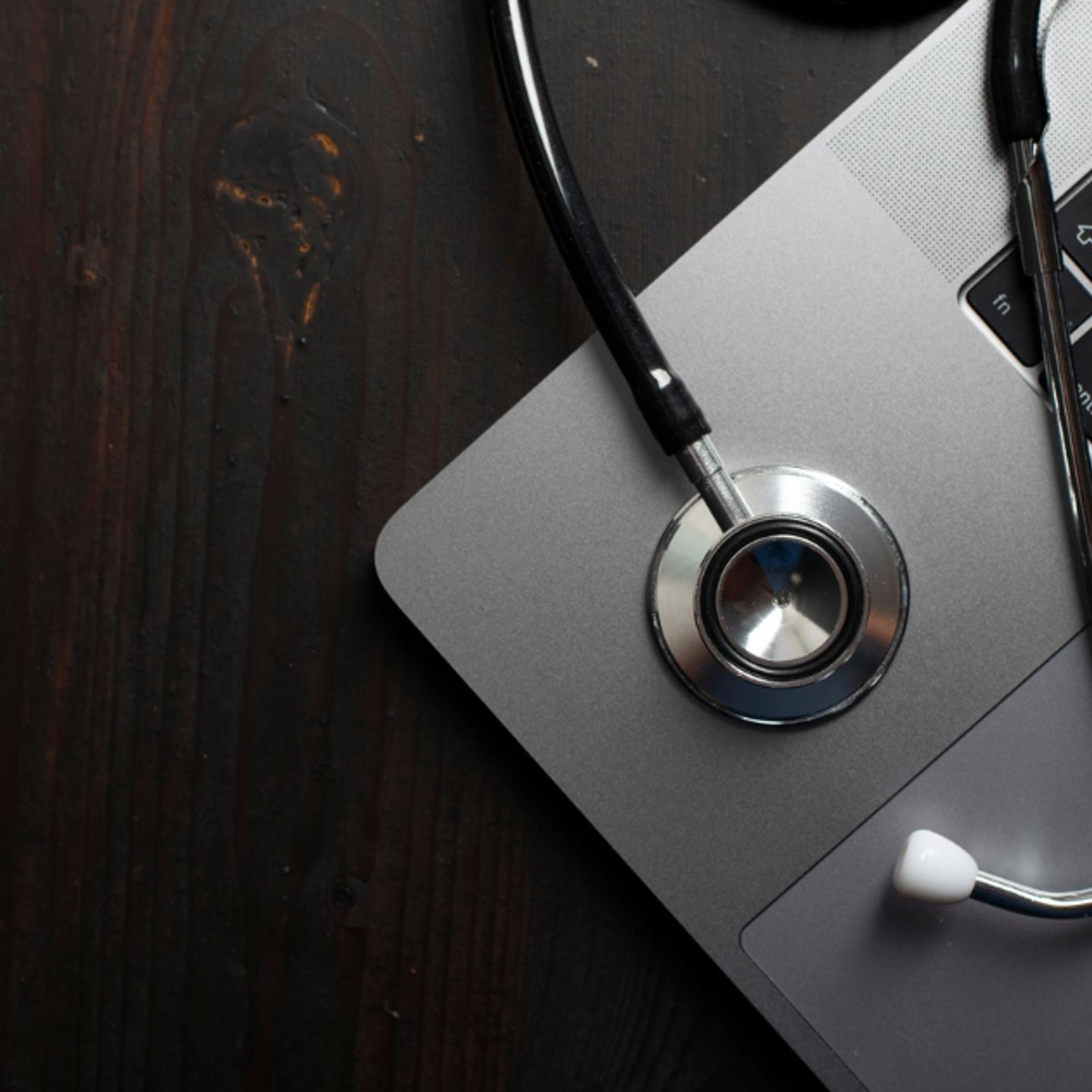 stethoscope on laptop image