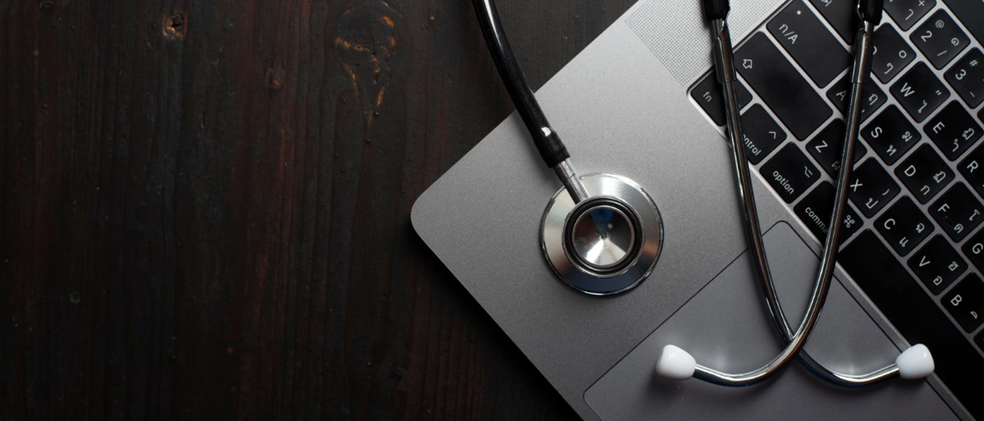 stethoscope on laptop image