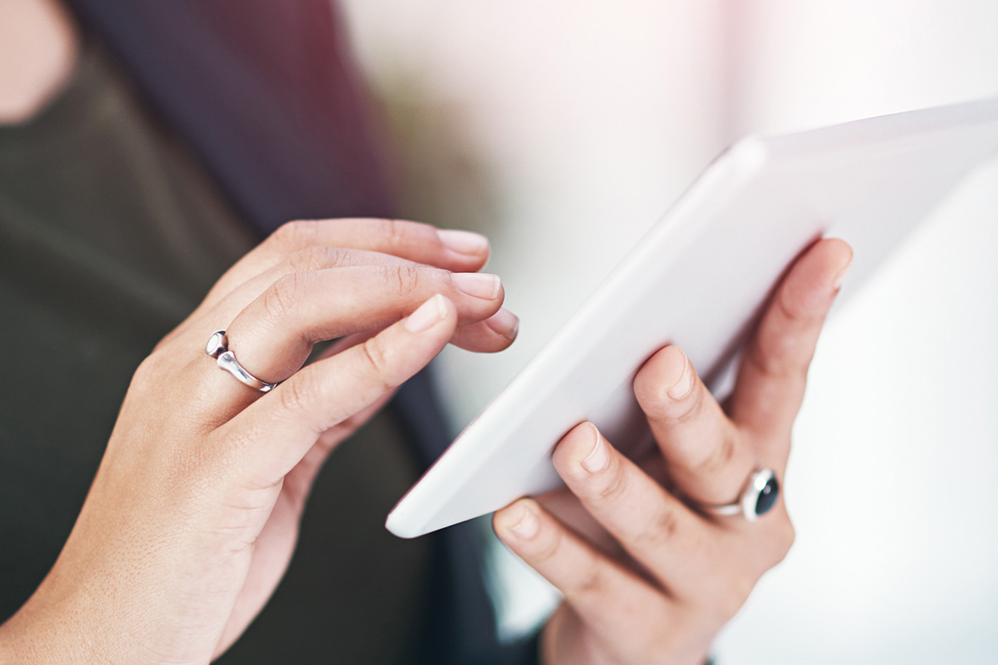 FullStack header image close up woman using tablet