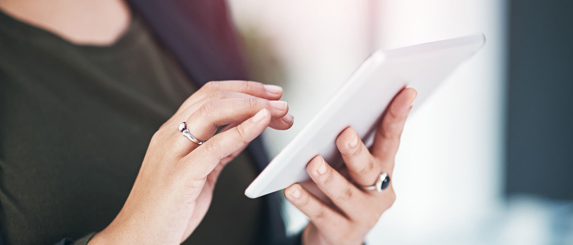 FullStack header image close up woman using tablet