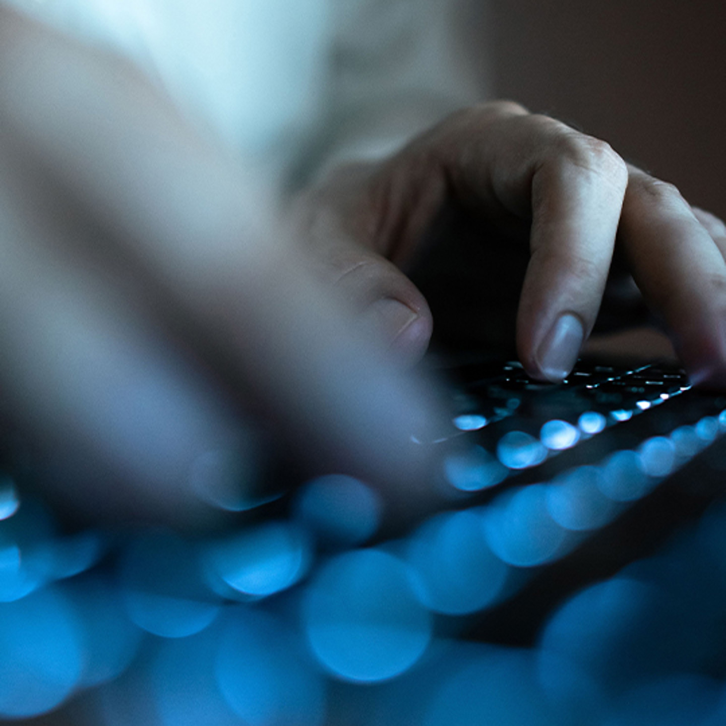 Trustarc Portrait 2 hands typing on keyboard