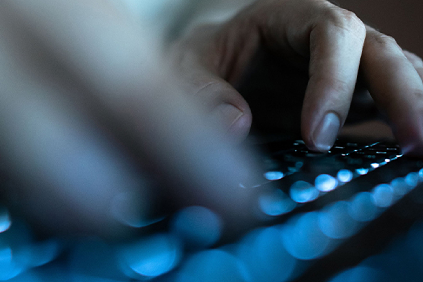 Trustarc Portrait 2 hands typing on keyboard