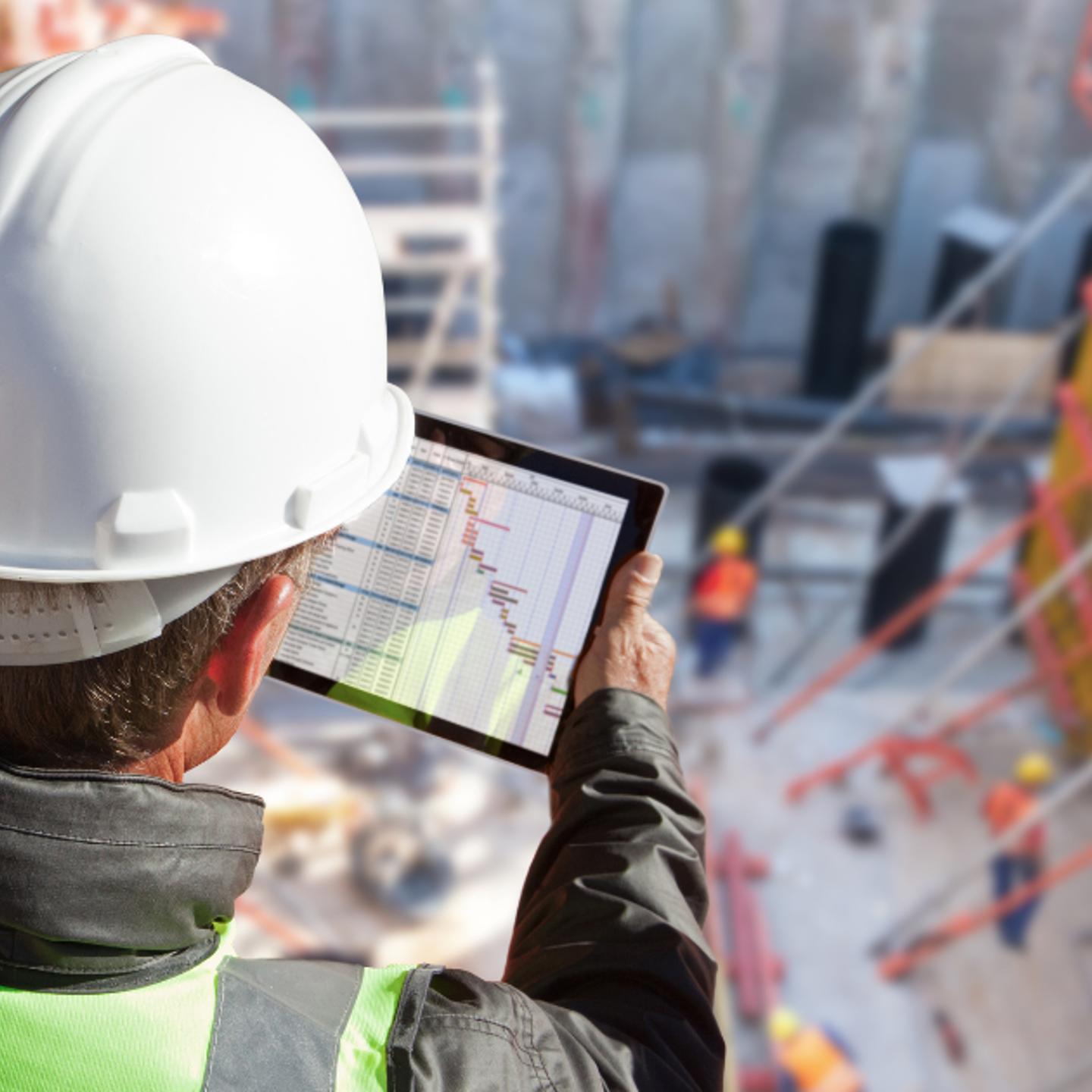 Builder looking at tablet