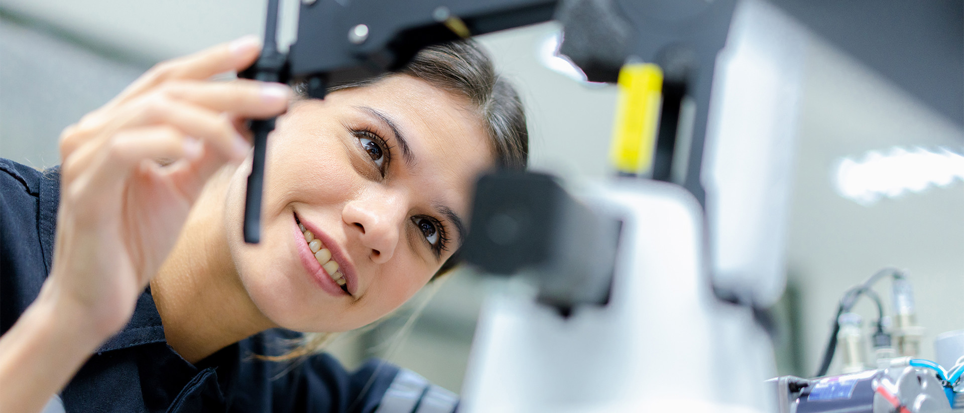 Lux Research Header 3 Woman looking at equipment