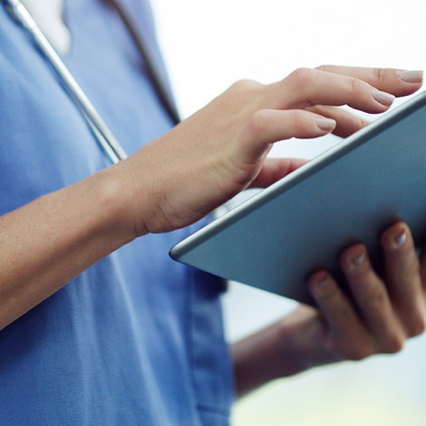 Finthrive Portrait 2 Nurse looking at tablet