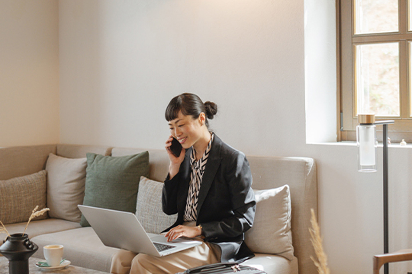 Single Digits Portrait 3 woman on phone working on laptop