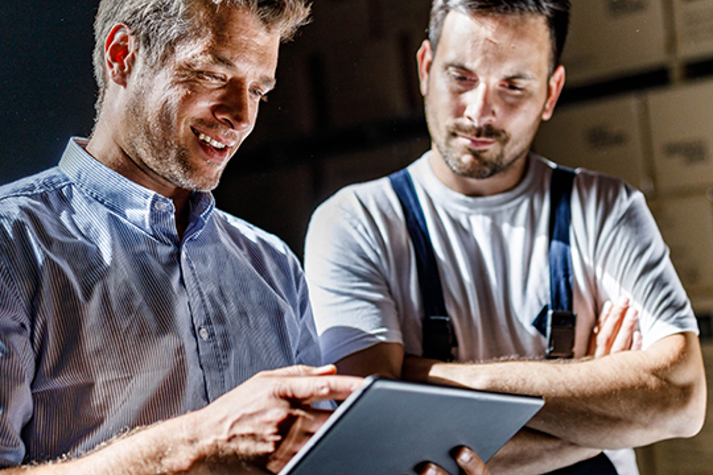  Buyers Edge Portrait 3 men pointing at tablet