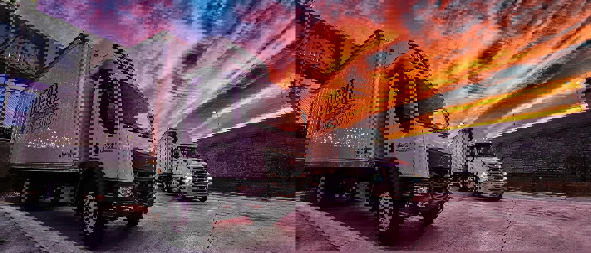 image of trucks at sunset
