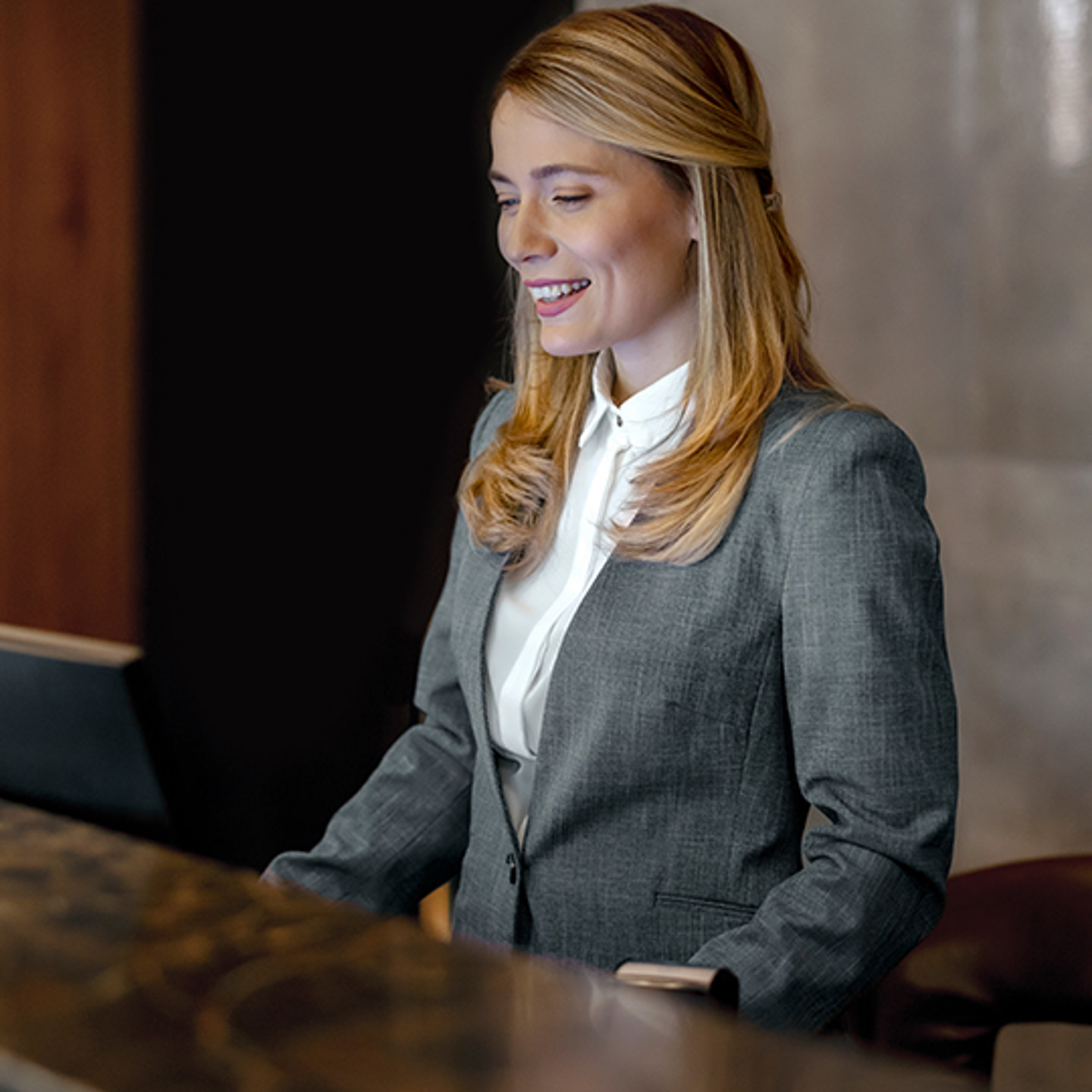 Single Digits Portrait 2 woman working at front desk