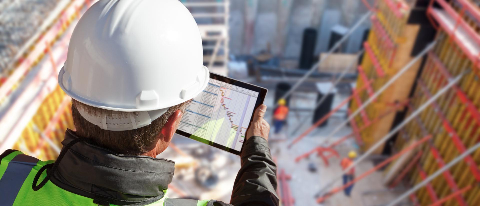 builder looking at tablet
