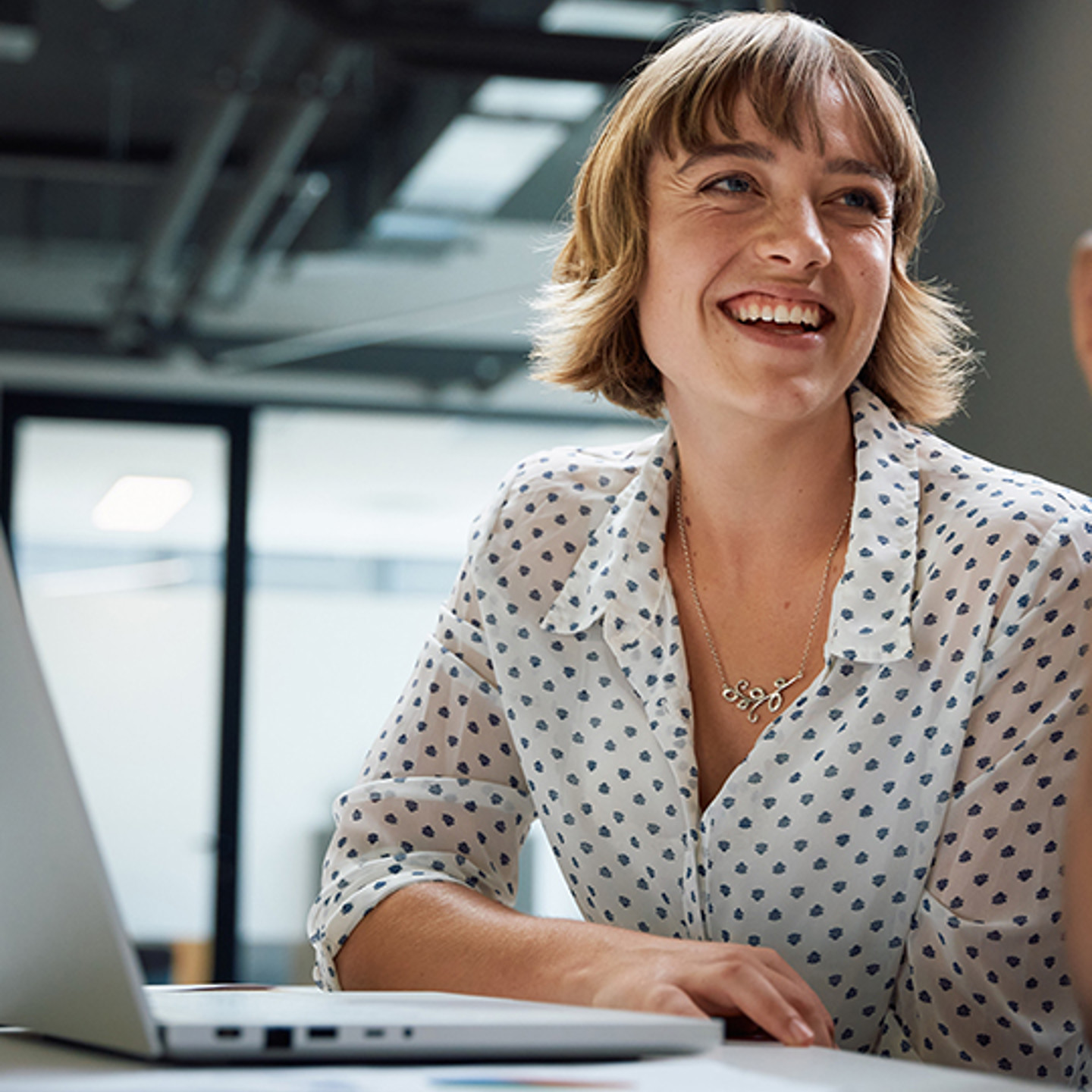 Vistage Portrait 3 woman smiling and working