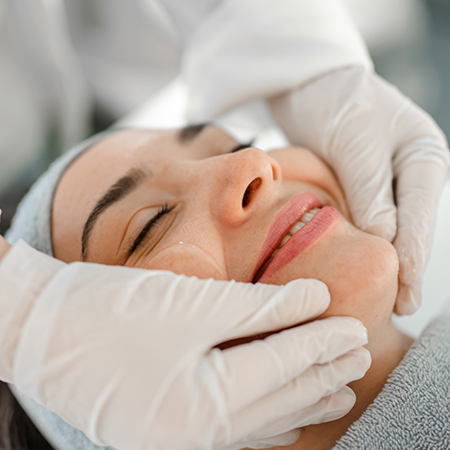 Integrated Dermatology Portrait 1 woman smiling getting a facial