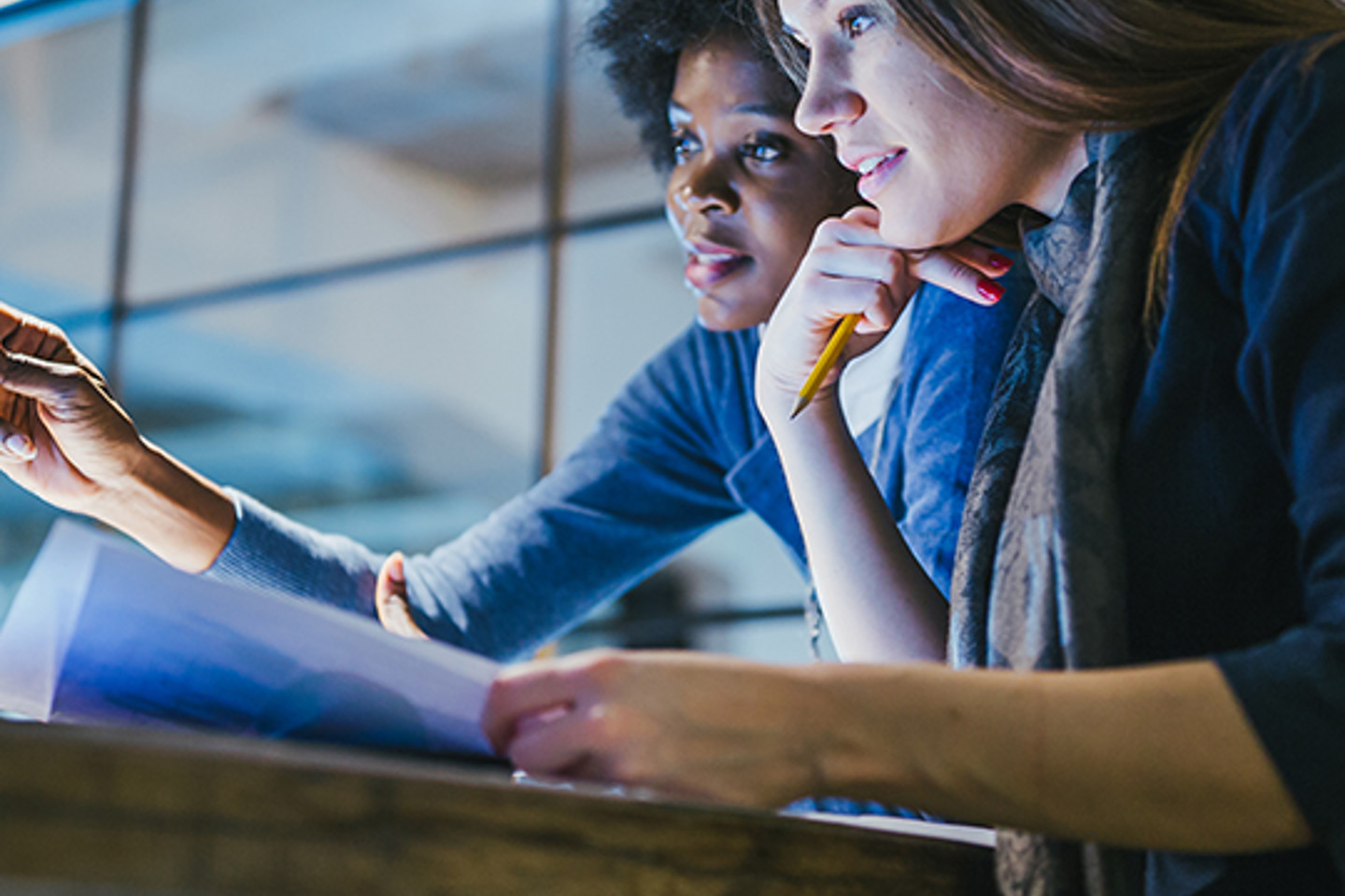Teamwork Com Portrait 1 two women working