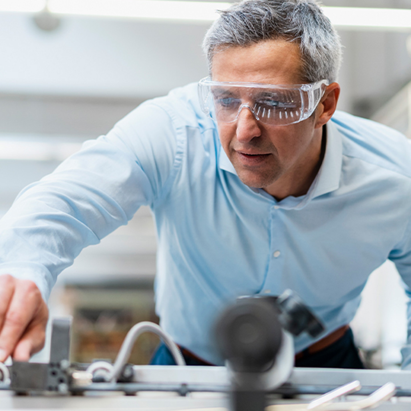 Lux Research Portrait 2 man working with safety goggles on