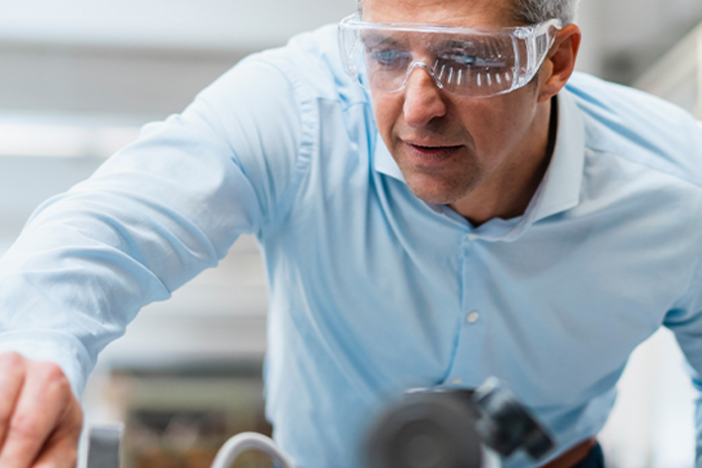 Lux Research Portrait 2 man working with safety goggles on