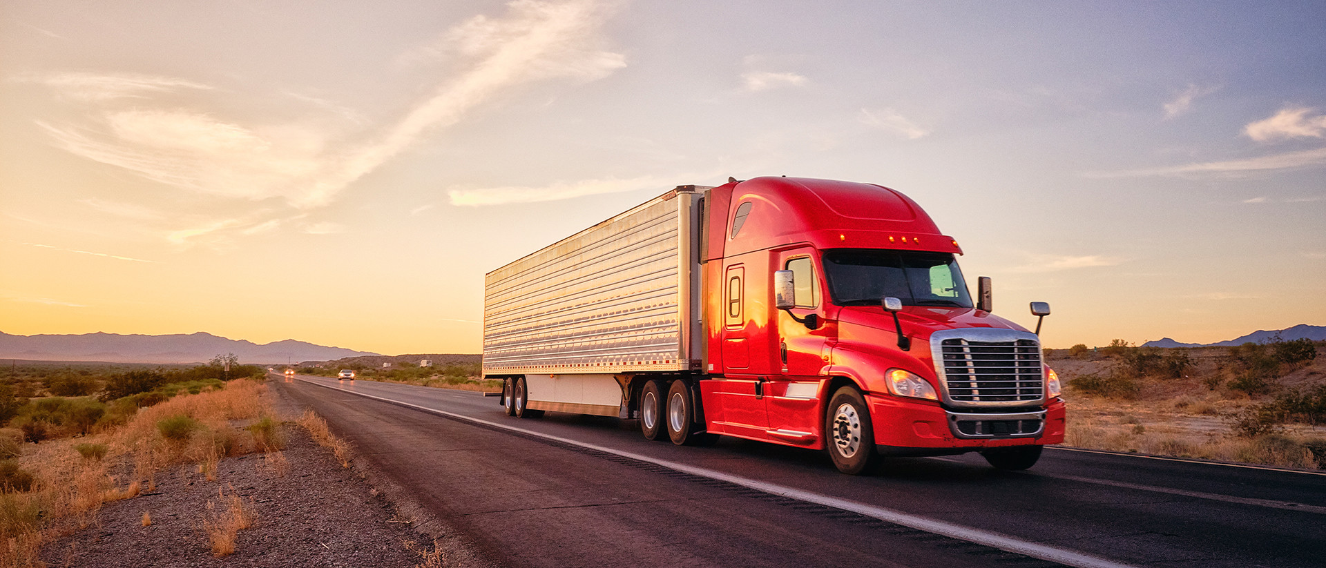 Truckstop Header 1 frontal view of truck on the road