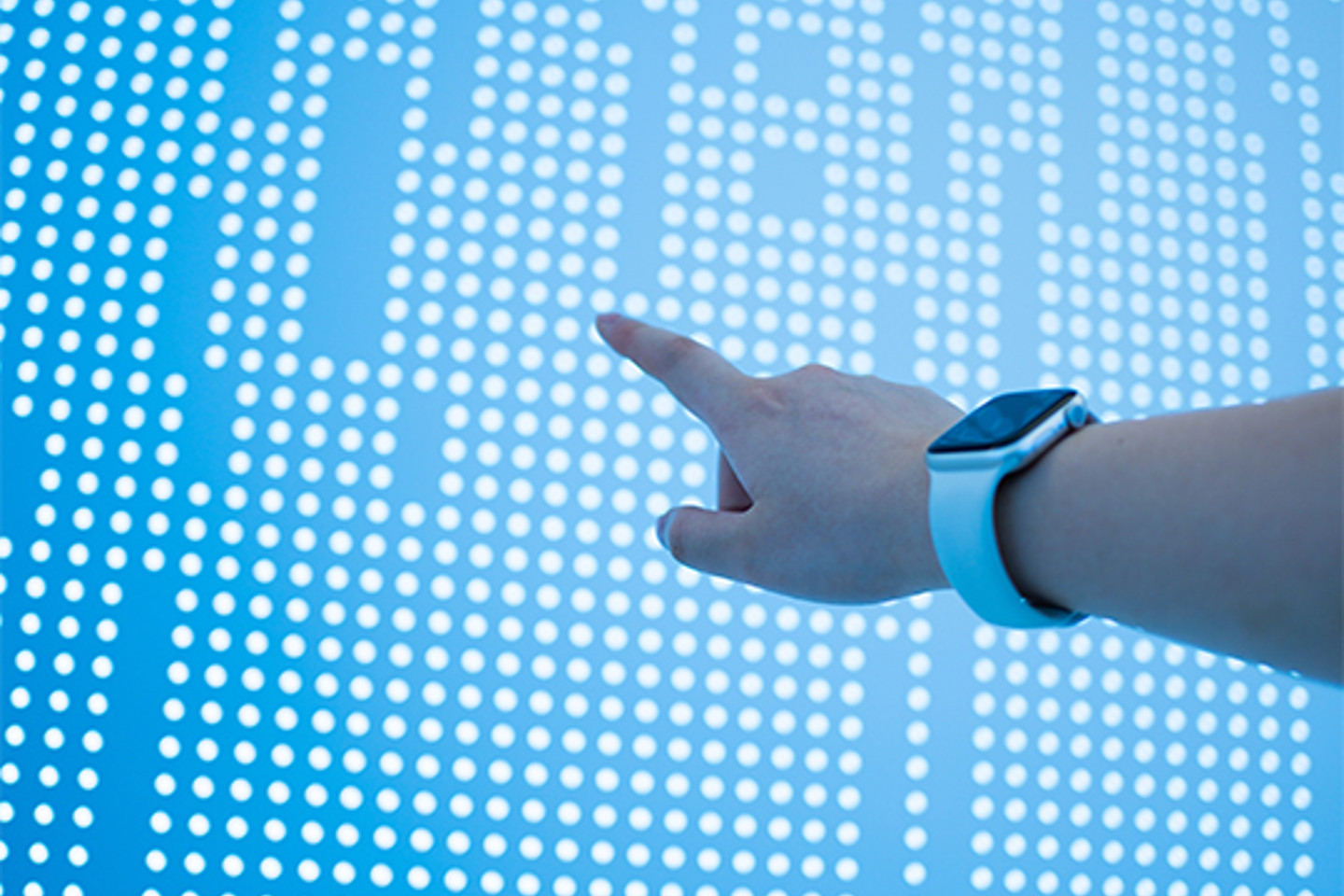 Discovery Data Portrait 3 finger pointed at dotted wall