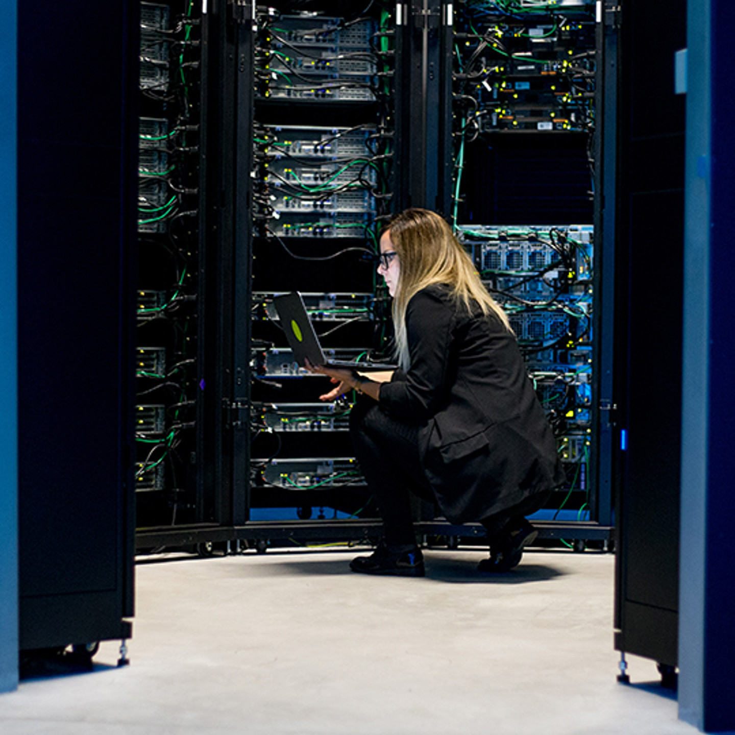 Connectria Portrait 2 woman crouching around servers