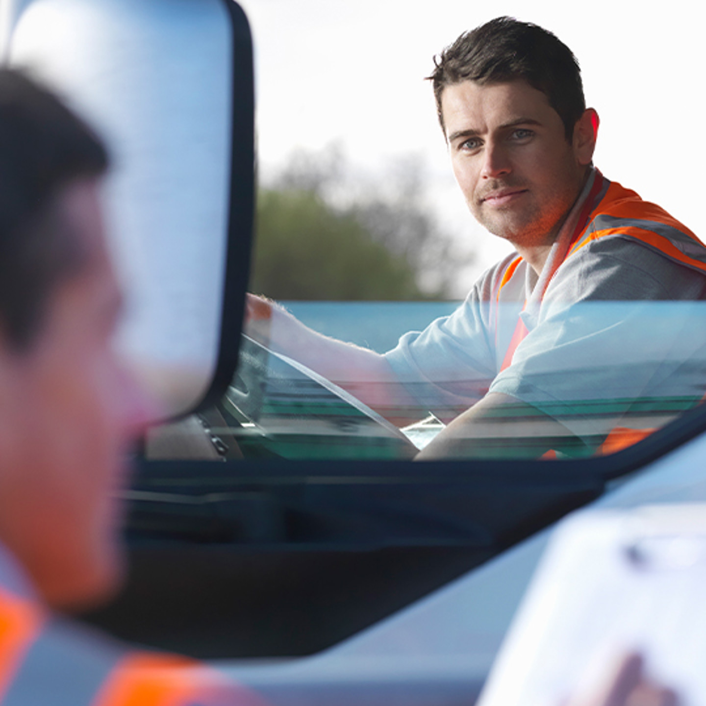 Seko Portrait 1 man in high vis looking out of window