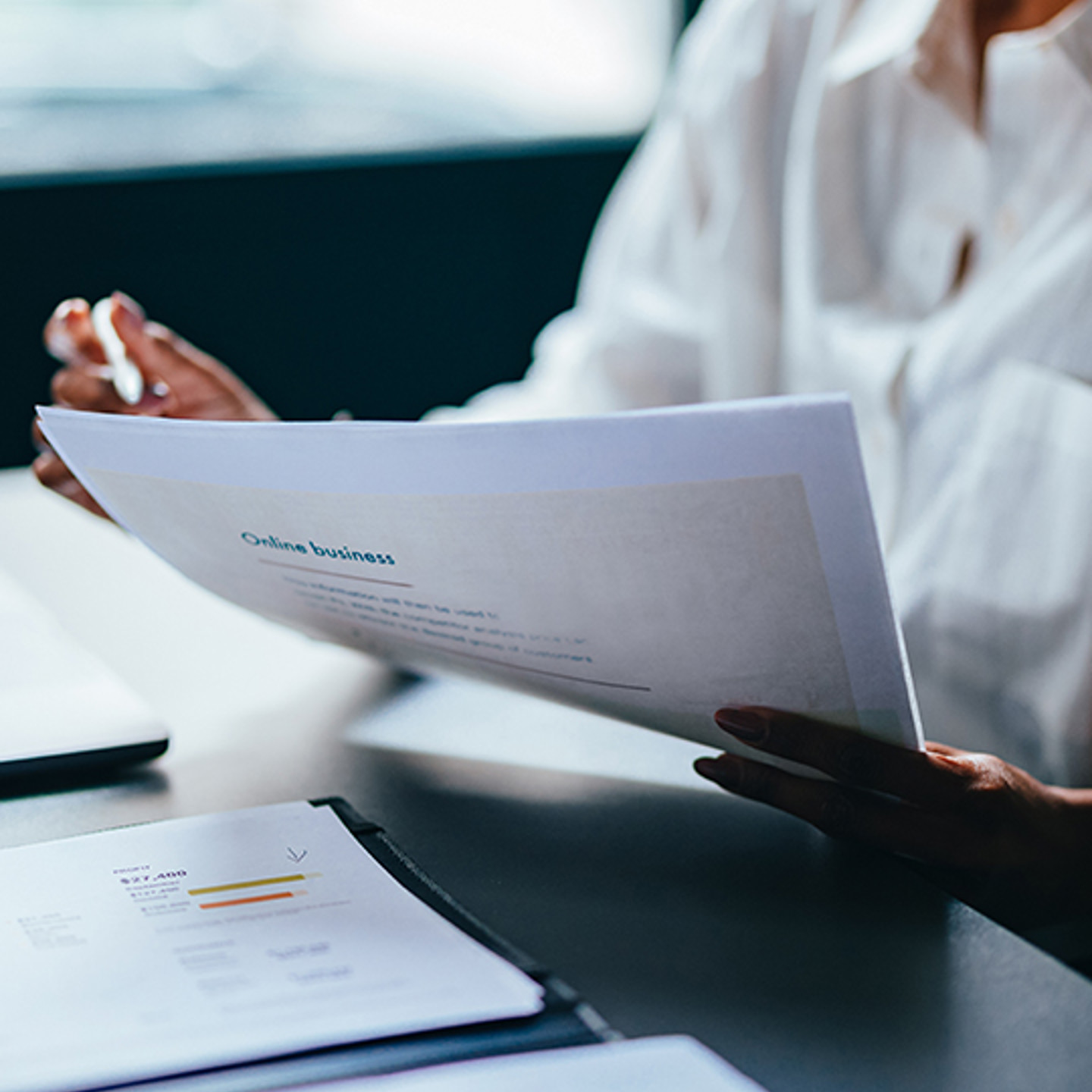 Netrics Portrait 3 person holding paperwork